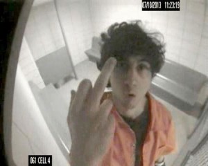 Convicted Boston bomber Dzhokhar Tsarnaev gestures towards a surveillance camera in his holding cell