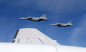 Saab JAS 39C Gripen fighter jets from F17 Wing of the Swedish Air Force demonstrate a mid-air interception over Sweden
