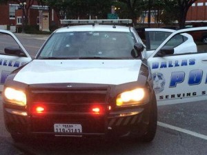 Handout shows several bullet holes in the windshield of a police patrol car in Dallas, Texas