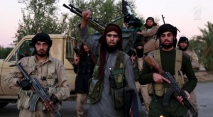 Image taken from Islamic State video footage shows a man identified in the subtitiles as Al Karar the Iraqi gesturing as he speaks