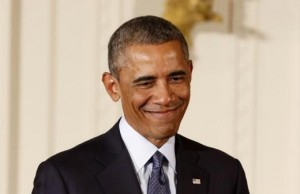 U.S. President Barack Obama smiles after he awards two Medals of Honor for actions during the Vietnam War while in the East Room of the White House in Washington