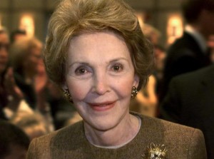 File photo of former U.S. first lady Nancy Reagan smiles as she passing photographers in Simi Valley